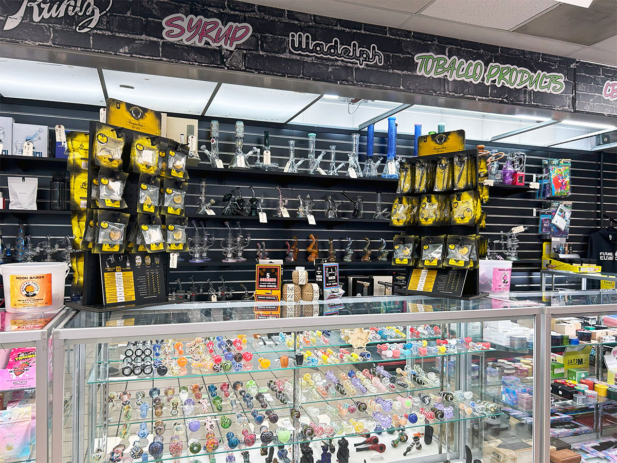 A product display of pipes, bubblers, and other smoking accessory products at our Bergenfield head shop and tobacco store.